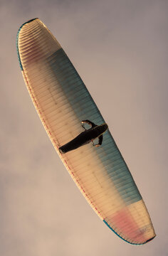 View of a colorful paraglider soaring through the scenic sky over Cape Town, Western Cape, South Africa.