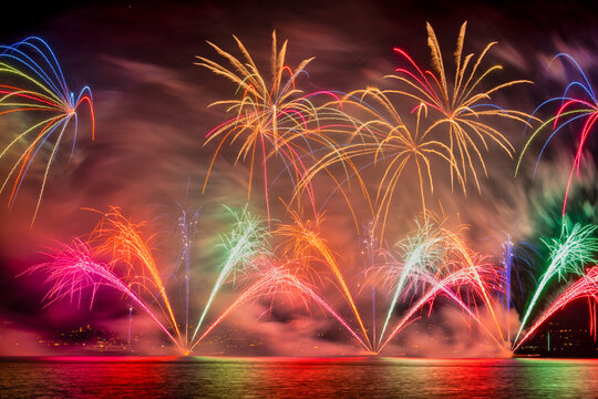 View of colorful fireworks illuminating the night sky over Lake Zurich, Zurich, Switzerland.