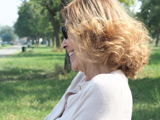 Senior woman smiling and relaxing in a park