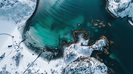 Aerial View of a Snowy Coastline and Turquoise Waters