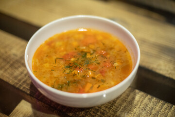 Soup on plate. Vegetable food. Delicious dish.