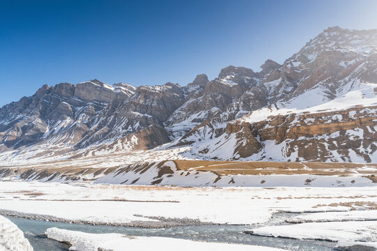 View of snow mountains and frozen rivers in winter, Pin Parvati Valley, Kaza, Himachal Pradesh, India.