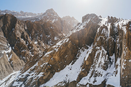 View of snow mountains and rugged rocks in a pristine winter landscape, Pin Parvati Valley, Himachal Pradesh, India.