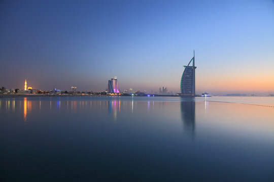 View of Burj Al Arab with beautiful sunset reflections over the sea, Dubai, United Arab Emirates.