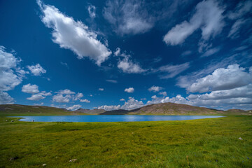 View of serene Sarfaranga Cold Deserts with Shigar River and majestic mountains under a blue sky, Skardu, Pakistan.
