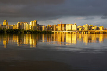 Mapo-gu, Seoul, South Korea - May 17, 2021: Sunset view of Han River with reflection of Bamseom Island and Gangbyeon Expressway and high-rise apartments on water