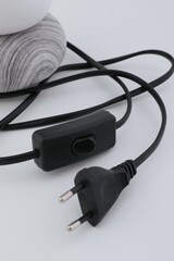 A stylish and beautiful table lamp with a floor lamp for a bedroom or a room. It is made in a modern style with stones and looks expensive. It is suitable for the interior of a house or room. a light 