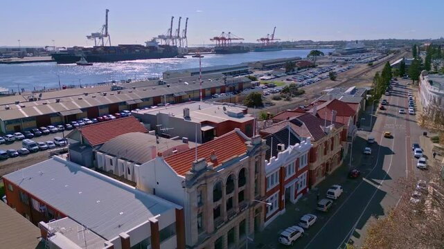 Old buildings on Phillimore Street in Fremantle with industrial port in background, Perth, Western Australia