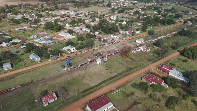 Drone aerial view of the small town of Guavirav&radic;&ne; in Corrientes, Argentina. Abandoned train. 4k.