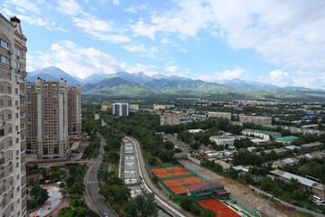 Fototapeta premium Almaty city and the Tien Shan Mountains on a summer day, Kazakhstan.