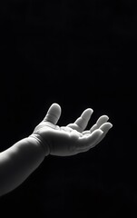 Fototapeta premium Newborn baby reaching out, symbolizing the start of a new life.