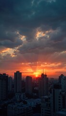 Fototapeta premium Spectacular Sunset Over Cityscape with Skyscrapers Silhouetted in the Background