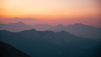 Silhouettes of mountains in a beautiful gentle haze, mountains at sunset or sunrise, natural...