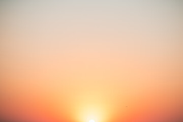 Naklejka premium Natural delicate background, sky at sunrise, color gradient from yellow to orange, delicate and smooth transition