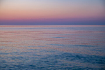 Beautiful gentle sunset on the sea, natural background, calm, serenity and peace of mind