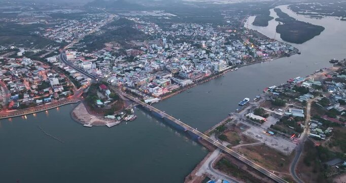 Top view aerial of Ha Tien City with development buildings, transportation, energy power infrastructure. Famous tourist city of Vietnam, sharing the border with Cambodia