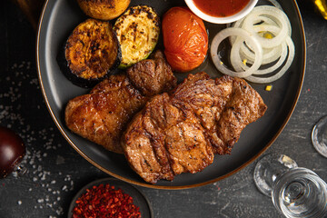 Portion of german grilled pork meat with vegetables