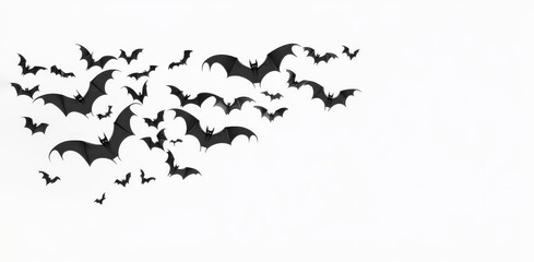 Fototapeta premium A flock of black and white bats flying in the sky