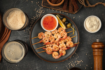 Portion of shrimp skewers with sweet and sour sauce