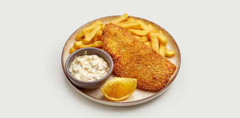 A classic British dish, Fish and Chips, is beautifully presented on a white plate. A crispy golden-brown fish fillet