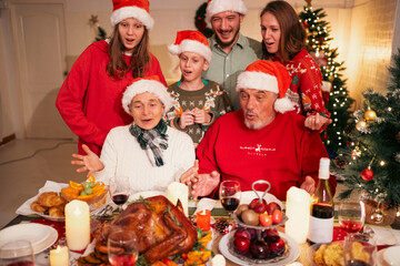 Merry Christmas Celebration, Happy Family Gather Together for Festive Holiday Party at Home, Enjoying Fun and Delicious Food, Smiling Children and Adults, Winter Joy Dinner in the New Year