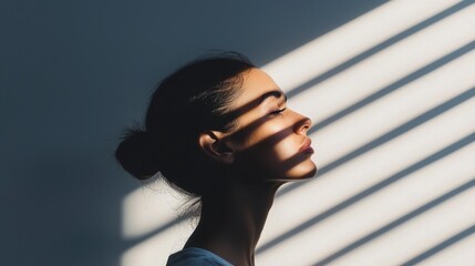 Silhouette of a Woman in Contemplation with Shadow Stripes on Her Face, Representing Mental Health and Emotional Struggles