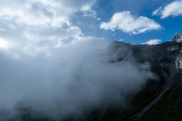 Aerial view of beautiful high altitude snow capped mountain waterfall landscape