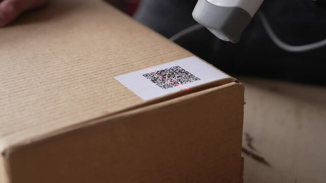 QR code scanning. The retailer checking goods packages and making inventory. Selling on the marketplace, small business