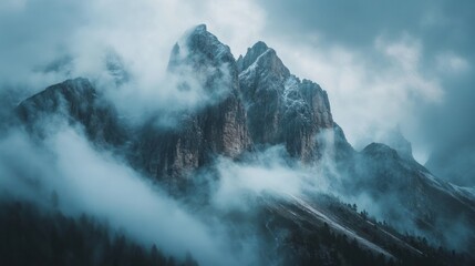 Fototapeta premium Majestic Mountain Peaks Enveloped in Mist