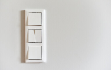 White switch on a light wall