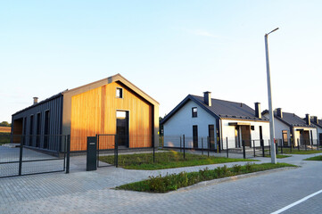 Barn House building. Street with Barnhouse in rural village. Modern Family house. Cottage Scandi...