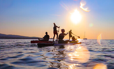 sup surfing in the sea
