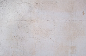 abstract background of an old shabby painted white wall close up