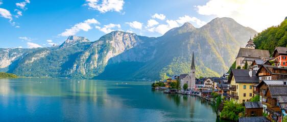 Experiencing the enchanting beauty of Hallstatt, Austria with stunning alpine reflections at sunrise