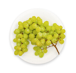 Juicy delicious fresh grapes on a white plate. Isolated on white. Vitamins, fruits, healthy food.