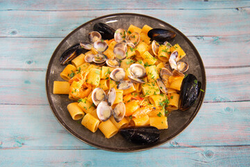 Mezze maniche pasta with seafood is the name of a typical seafood dish in Italy