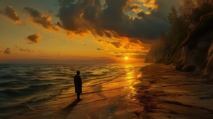Fototapeta premium A solitary figure stands on a beach at sunset, watching the waves as the sun dips below the horizon. The dramatic sky and golden light create a contemplative and serene mood, ideal for themes of