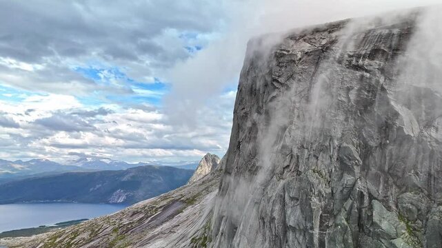 Clouds and fog rolling over mountain tops in Efjord in Northern Norway