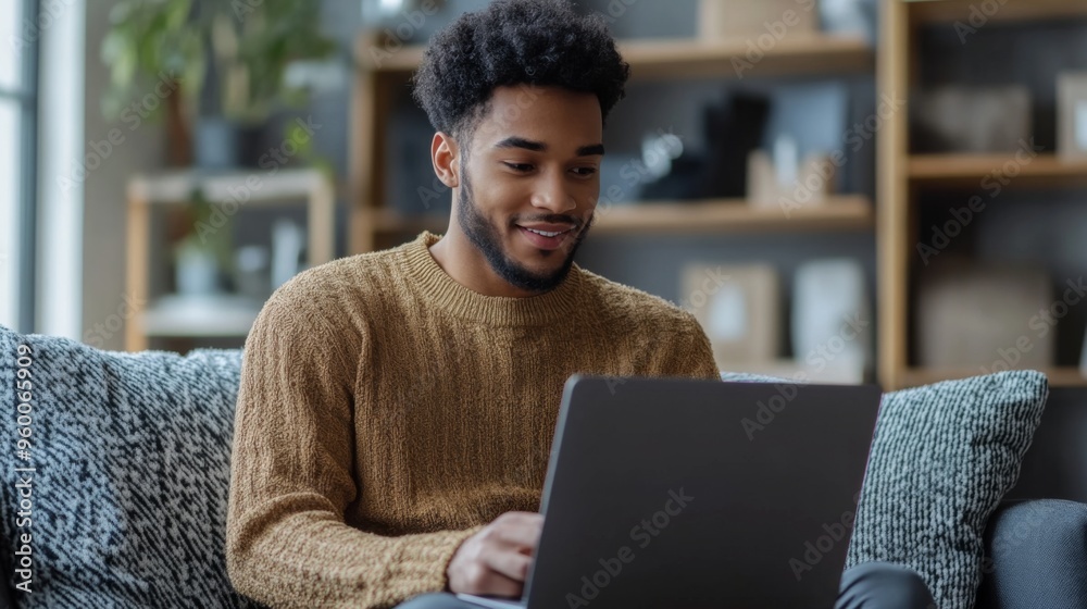 Sticker Young man using laptop at home