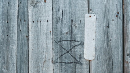 Weathered Gray Wooden Panels With Symbol Spray Painted