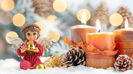 Angel figurine with Christmas decoration and holiday spirit featuring candles and pinecones