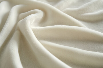 Obraz premium A light white textured surface with a soft, velvety texture, reminiscent of the delicate touch of suede or microfiber.