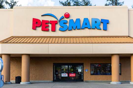 Beaverton, OR, USA - April 2, 2024 - Famous pets store chain Petsmart signage on on its store building captured at sunny spring day. high quality picture for download