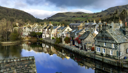 Fototapeta premium A picturesque village nestled along a river, with charming stone houses, a reflective water surface, and rolling hills in the background.