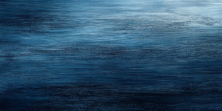 A blue textured surface with a soft, brushed finish, showcasing fine, parallel lines that add a soft, linear texture.