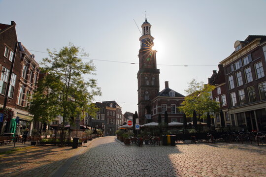 Groenmarkt, a pedestrian street located in the old picturesque town of Zutphen, Gelderland, Netherlands, with the tower Wijndragerstoren (or Wijnhuistoren)