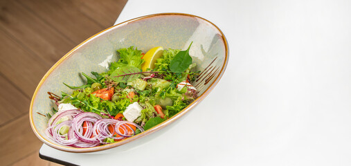 vegetable salad with feta cheese mixture of green leaves and vegetables, Long banner format. top view. copy space for text