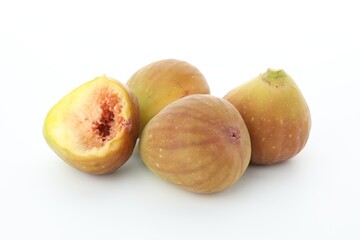 Many fresh ripe figs on white background