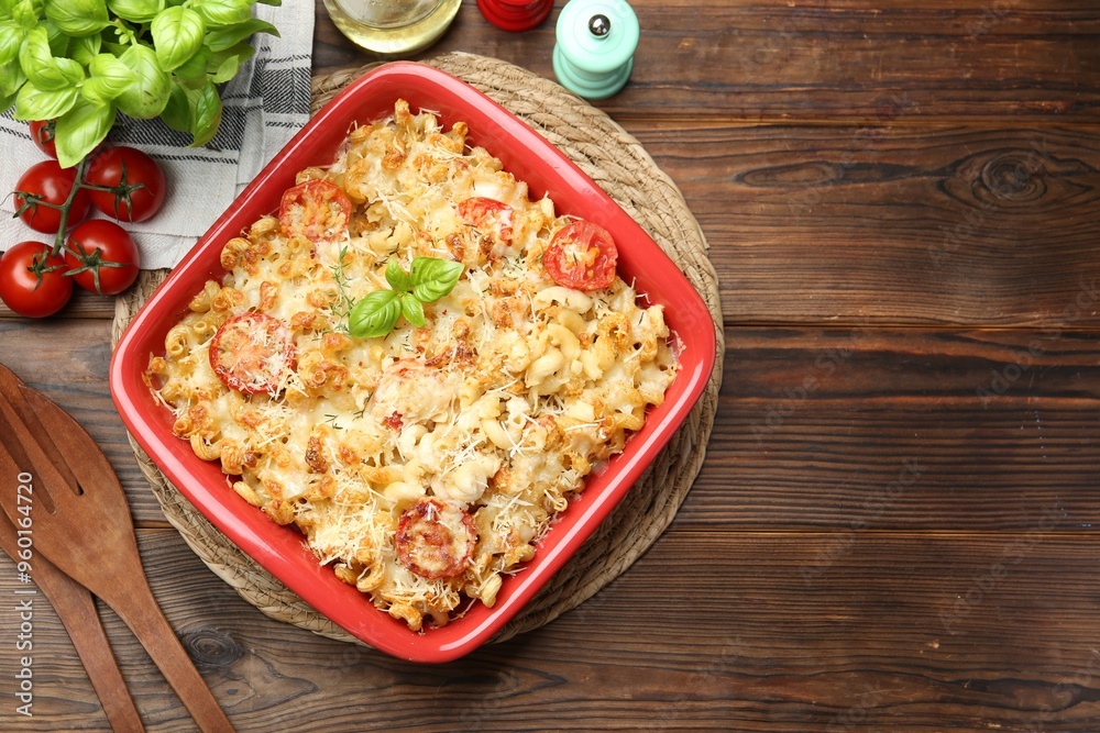 Sticker Delicious al forno pasta in baking dish on wooden table, flat lay