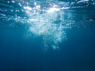 Bubbles under the sea in the crystal clear green sea water. Mediterranean bubbles. Real image very...